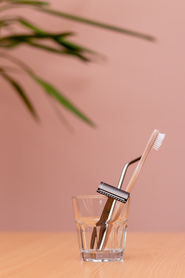 Bamboo toothbrush, metal straw, and razor; Credit: Oana Cristina